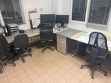 an image of an office cubicle with two desks and two computer monitors