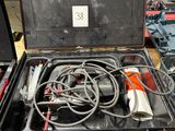a black case with tools inside of it on a table