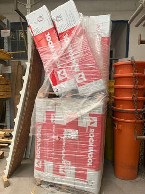 a large pile of boxes and other items in a garage