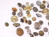 many different types of buttons on a white surface