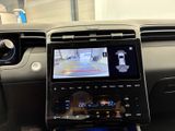 an image of a car dashboard with a gps device and a steering wheel