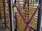 purple and yellow scaffolding in a large warehouse with lots of shelves