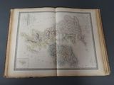 an open book with a map of the world on it