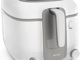 an image of a white and gray air fryer on a white surface