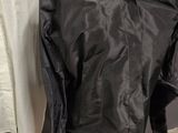 an image of a black shirt on a mannequin stand
