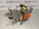 a chainsaw is sitting on a table in front of a sign