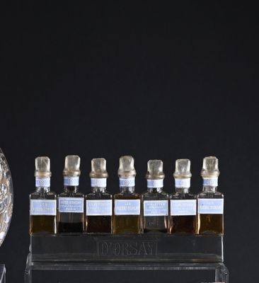 bottles of liquor on display in front of a black background