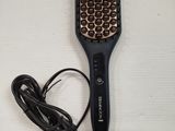 a hair brush that is sitting on a table