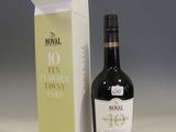 a bottle of wine sitting next to a box of wine