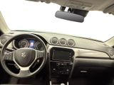 the interior of a car with a steering wheel and dashboard controls