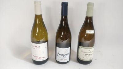 three bottles of wine sitting next to each other on a table