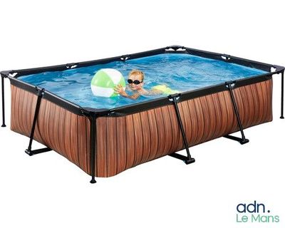 an image of a child playing in a pool with an inflatable ball