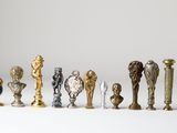 a lot of different types of trophies on a white surface