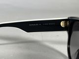 a close up of a pair of sunglasses on a table