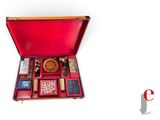 a red case with a lot of items inside of it