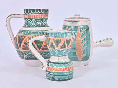 two vases that are sitting next to each other on a table