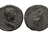 an ancient coin with a woman and a man on it