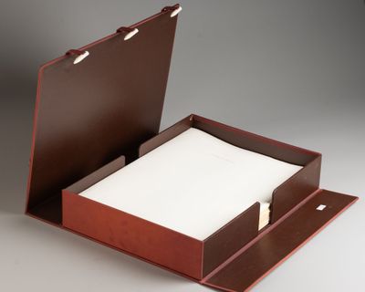an open box with a piece of paper inside of it
