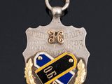 a close up of a medal on a black surface with a black background