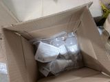 a cardboard box with a bunch of items inside of it
