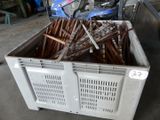 a crate full of screws and nails in a garage