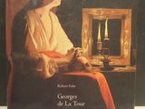 a book with a picture of a woman sitting in front of a mirror