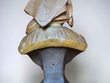a sculpture of a hat on top of a table