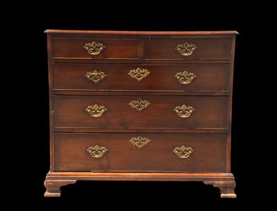 an image of a chest of drawers on a black background