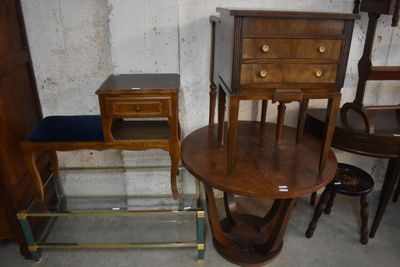 a small table with two chairs and a table with a drawer on top of it