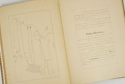 an open book with a drawing on it on a table