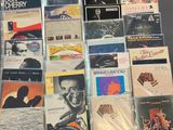 a lot of cd ' s and cds on the table