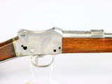 an old gun with a wooden handle on a white background
