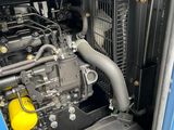 a large engine in the back of a blue truck