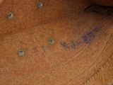 a close up of a brown hat with writing on it