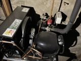 an image of an air compressor in a garage