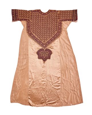 an old dress with a design on the front of it
