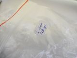 a plastic bag with a sticker on it sitting on a table