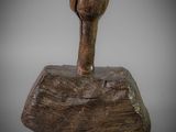 a close up of a wooden object on a white surface