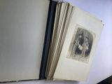an open book with a picture of a woman holding a child
