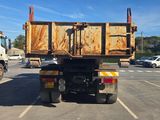 a dump truck that is parked in a parking lot