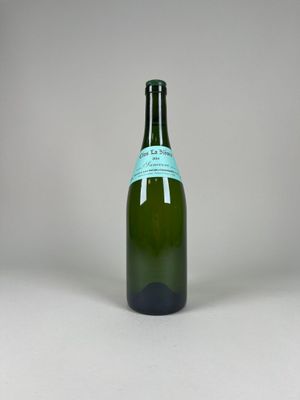 a bottle of wine that is sitting on a table