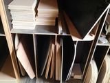 a lot of books on a pallet in a room