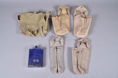 six pairs of canvas pouchs and a blue bottle on a white surface