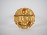 an image of a gold broochle with a buddha on it
