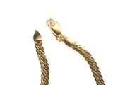 a gold chain with a clasp on a white background