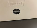 an image of a white toaster sitting on top of a counter