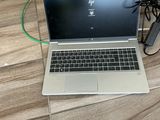 a laptop that is sitting on the floor next to a charger