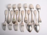 a lot of forks and spoons sitting on a table