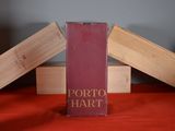 a red book sitting on top of a red table