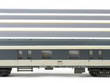 four train cars that are lined up on a white surface